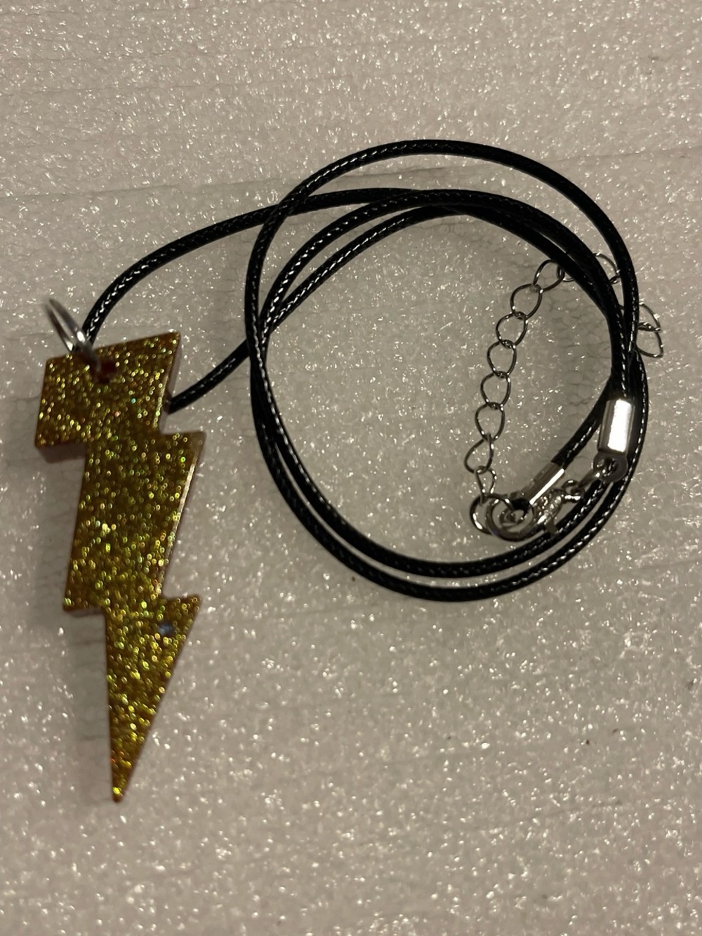 Gold Lightning Bolt Pendant Necklace on Black Cord